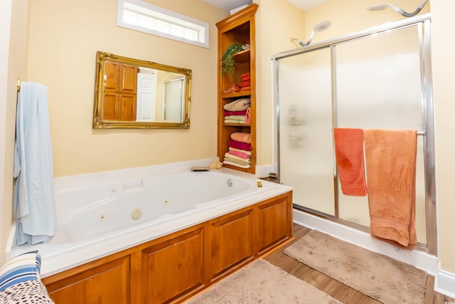 4244 Luck Ave, Little River, SC 29566 - full bath featuring a tub with jets, a stall shower, and wood finished floors