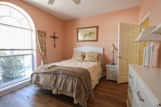 bedroom with dark wood-style flooring and ceiling fan