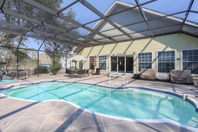 outdoor pool featuring a patio and a lanai