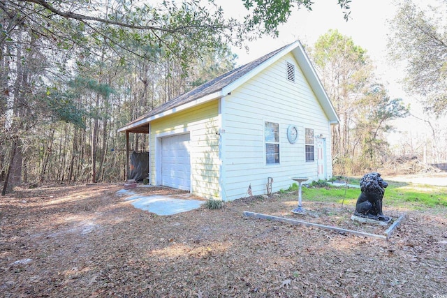 4244 Luck Ave, Little River, SC 29566 - view of home's exterior featuring an outdoor structure and a detached garage