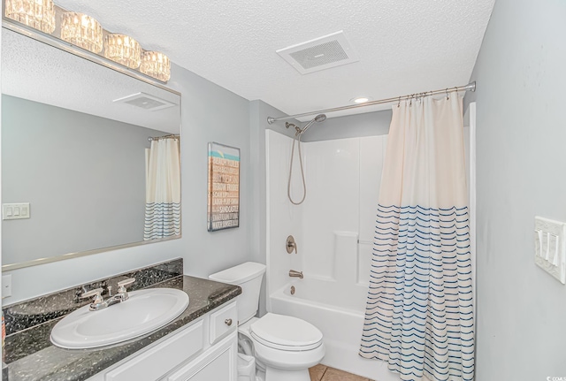 full bath featuring a textured ceiling, vanity, toilet, shower / tub combo with curtain, and tile patterned flooring