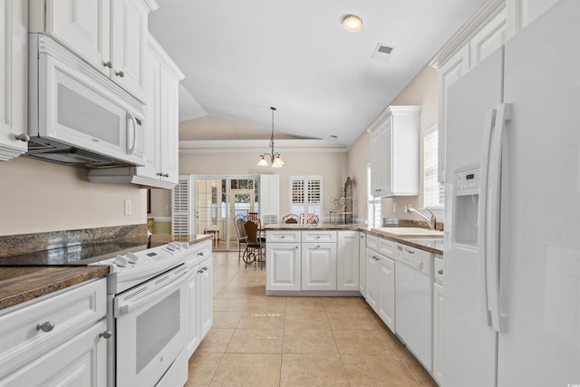 kitchen with white appliances, white cabinets, a sink, and light tile patterned flooring