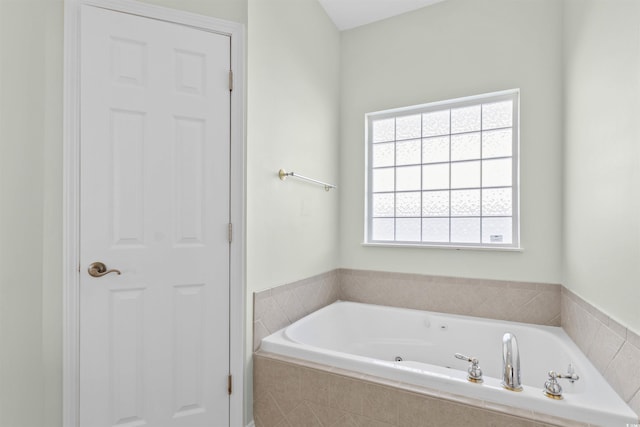 full bathroom with a jetted tub