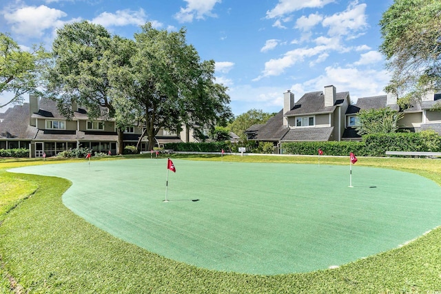 view of home's community with a lawn