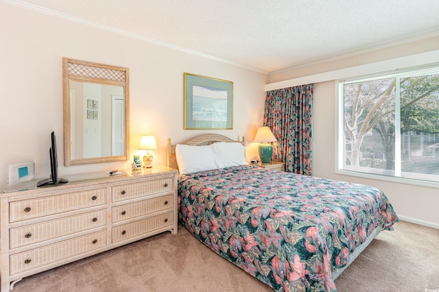 bedroom with ornamental molding, a textured ceiling, and light colored carpet