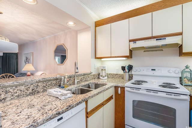 kitchen featuring a textured ceiling, under cabinet range hood, white appliances, a sink, and crown molding