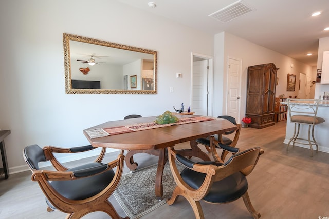 dining room featuring recessed lighting, visible vents, light wood-style flooring, and baseboards