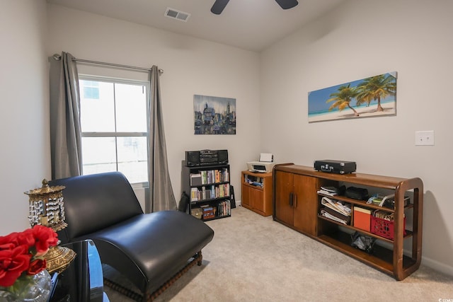 sitting room with carpet flooring, baseboards, visible vents, and ceiling fan