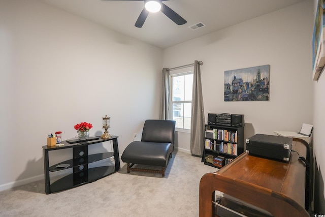 office featuring a ceiling fan, baseboards, visible vents, and carpet floors