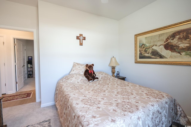 carpeted bedroom with baseboards