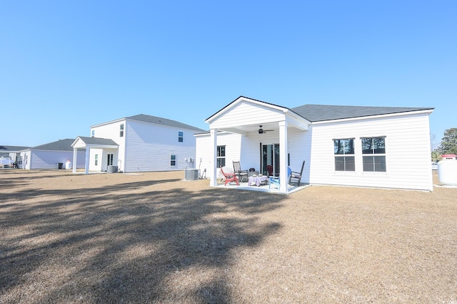 rear view of property with central AC unit, a patio area, and ceiling fan