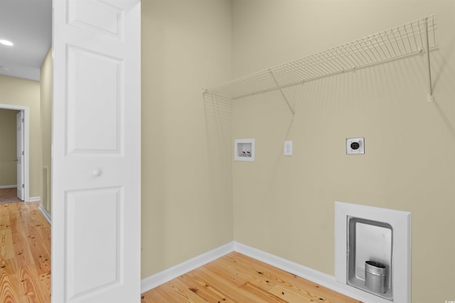 laundry room featuring light wood-style flooring, laundry area, washer hookup, baseboards, and electric dryer hookup