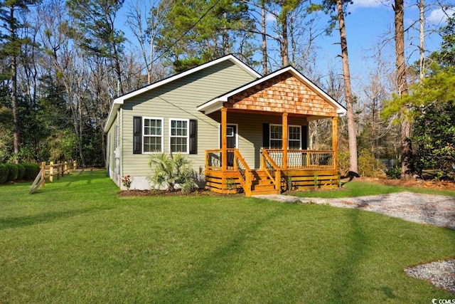 bungalow with a porch and a front yard