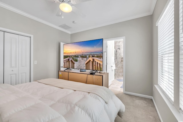 bedroom with baseboards, visible vents, light colored carpet, ornamental molding, and a closet