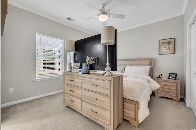 bedroom with light carpet, a ceiling fan, visible vents, baseboards, and ornamental molding