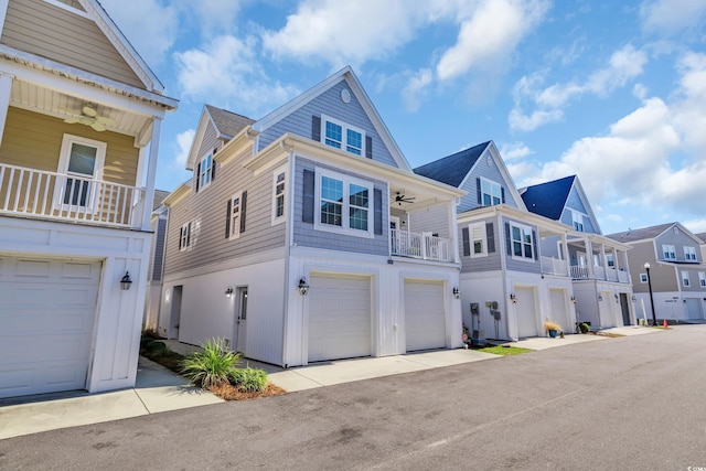 view of front of property featuring ceiling fan and a garage