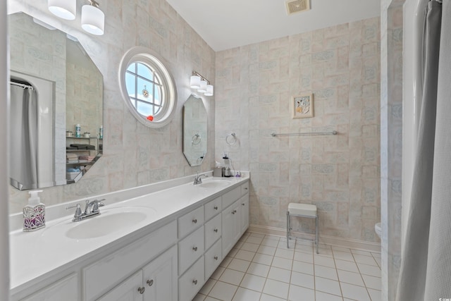 4306 Windy Heights Dr, North Myrtle Beach, SC 29582 - bathroom with tile patterned floors, double vanity, and toilet