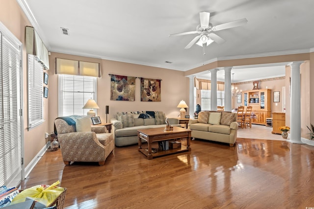 4306 Windy Heights Dr, North Myrtle Beach, SC 29582 - living area featuring decorative columns, crown molding, light wood-style floors, ceiling fan, and baseboards