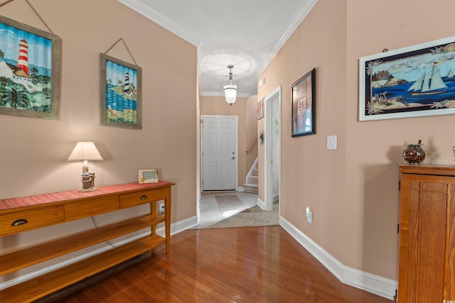 4306 Windy Heights Dr, North Myrtle Beach, SC 29582 - foyer entrance featuring crown molding, wood finished floors, baseboards, and stairway