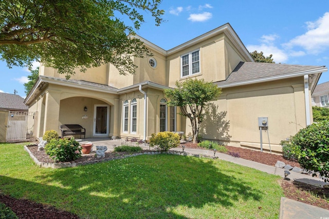 4306 Windy Heights Dr, North Myrtle Beach, SC 29582 - back of property with stucco siding, a yard, and a patio area