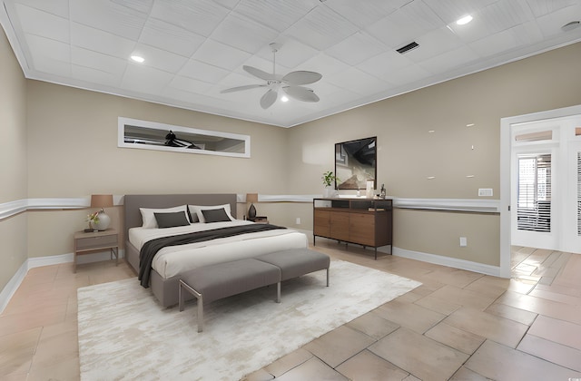 bedroom with light tile patterned flooring, visible vents, ceiling fan, and baseboards