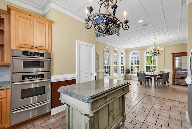 kitchen featuring visible vents, crown molding, double oven, a notable chandelier, and a warming drawer