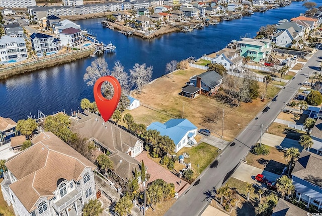 aerial view featuring a water view and a residential view