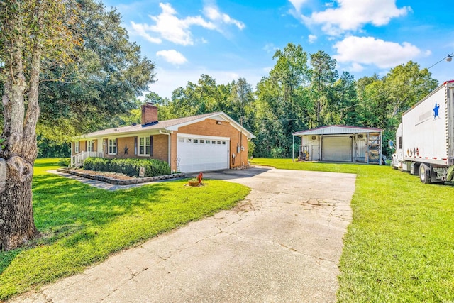 single story home featuring a front lawn, a chimney, a detached garage, and brick siding