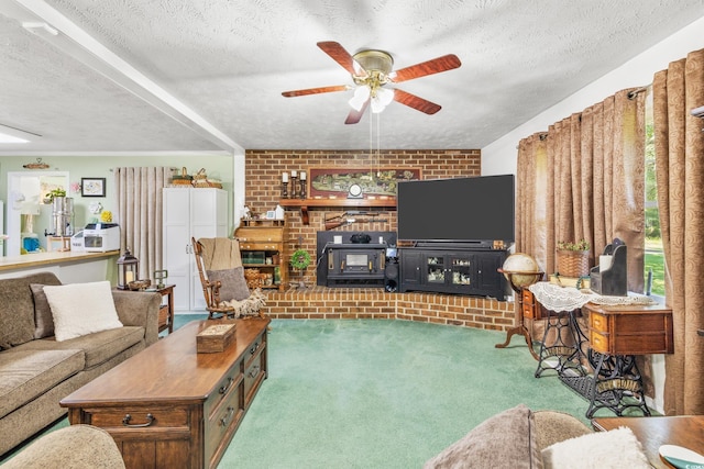 carpeted living area featuring a ceiling fan, a wood stove, a textured ceiling, and brick wall