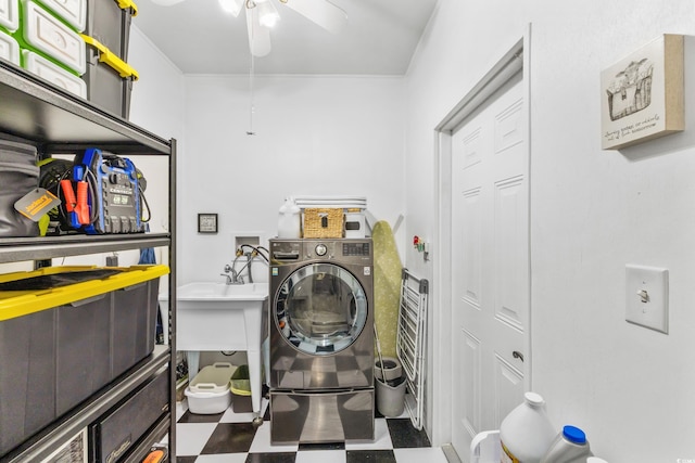 clothes washing area with ceiling fan, laundry area, washer / clothes dryer, and tile patterned floors