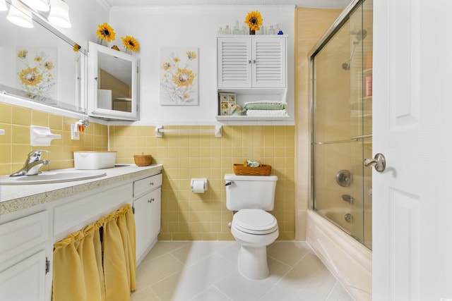 bathroom with toilet, enclosed tub / shower combo, tile patterned floors, crown molding, and vanity