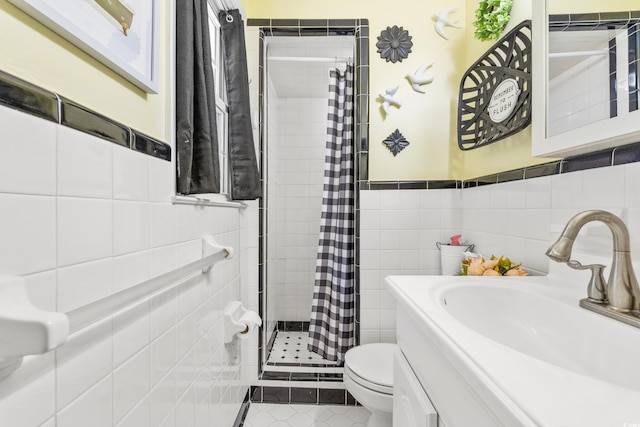 full bathroom featuring a stall shower, toilet, tile patterned flooring, vanity, and tile walls