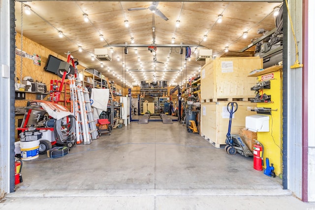 garage with a workshop area and a ceiling fan