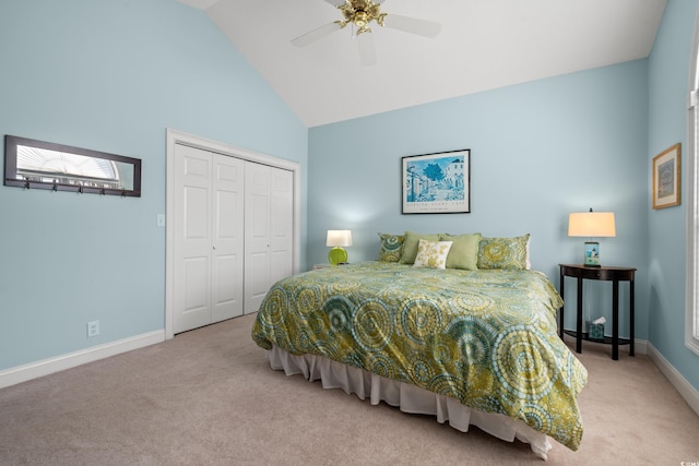 carpeted bedroom featuring ceiling fan, high vaulted ceiling, a closet, and baseboards