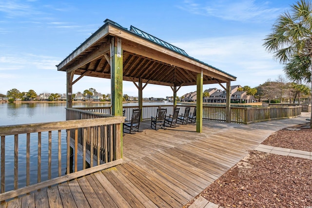 view of dock featuring a water view and a gazebo