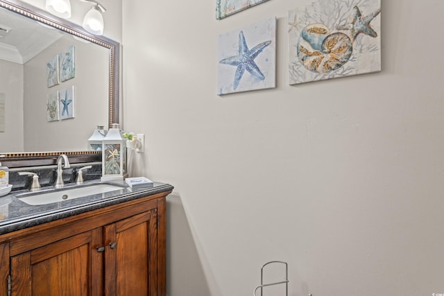 bathroom featuring visible vents, crown molding, and vanity