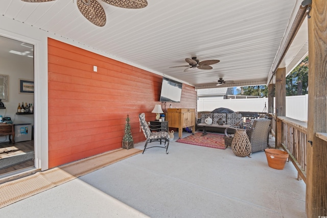 view of patio / terrace featuring ceiling fan and fence