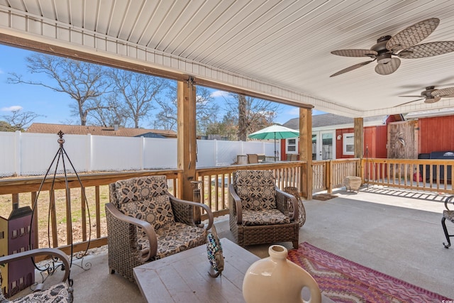 exterior space with ceiling fan and a fenced backyard