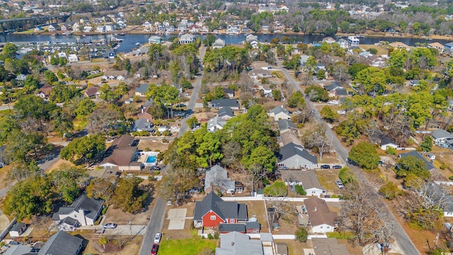 birds eye view of property featuring a water view and a residential view