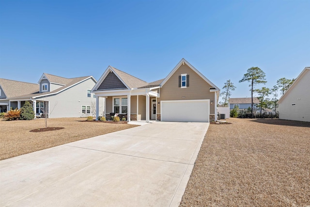 view of front of property featuring driveway and central AC unit