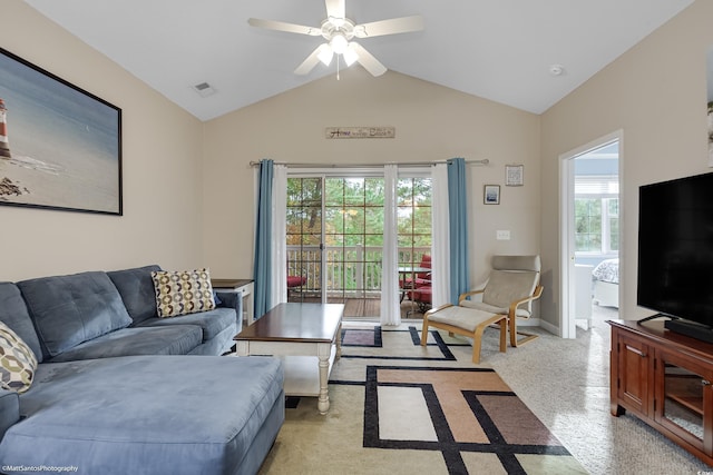 living area featuring ceiling fan, baseboards, visible vents, and vaulted ceiling