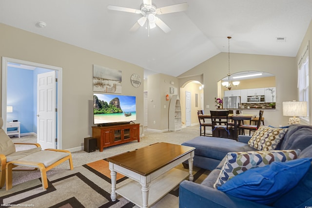 living area with arched walkways, light carpet, vaulted ceiling, and visible vents