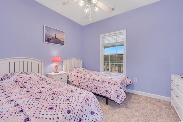 bedroom featuring carpet, visible vents, baseboards, and ceiling fan