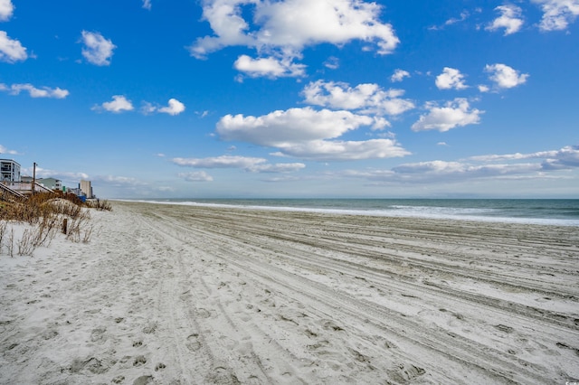 property view of water featuring a beach view