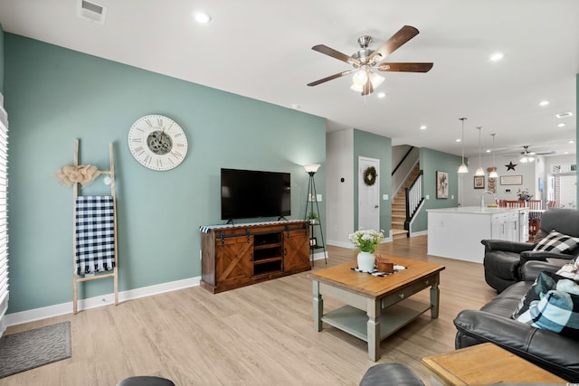 living room with recessed lighting, visible vents, stairway, light wood-style floors, and a ceiling fan