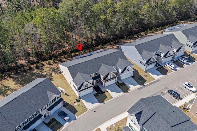 birds eye view of property with a residential view