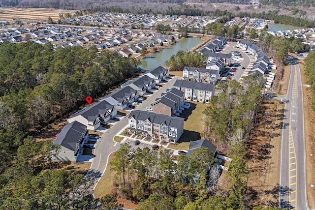 bird's eye view featuring a water view and a residential view