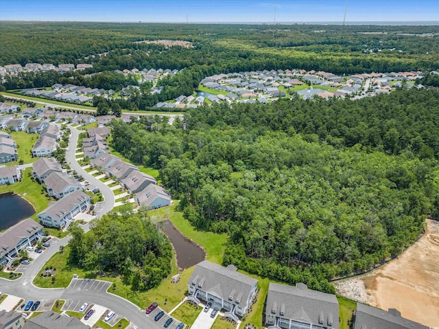 aerial view with a forest view and a residential view