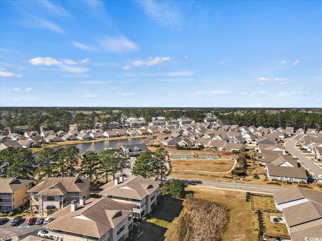 drone / aerial view featuring a water view and a residential view