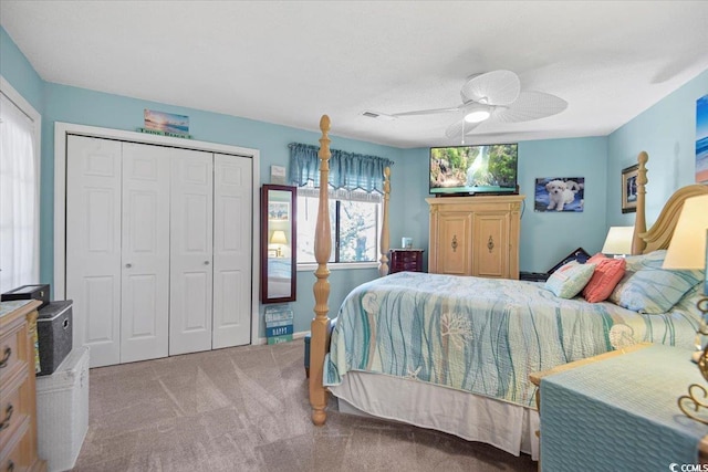 bedroom with carpet flooring, a closet, visible vents, and ceiling fan